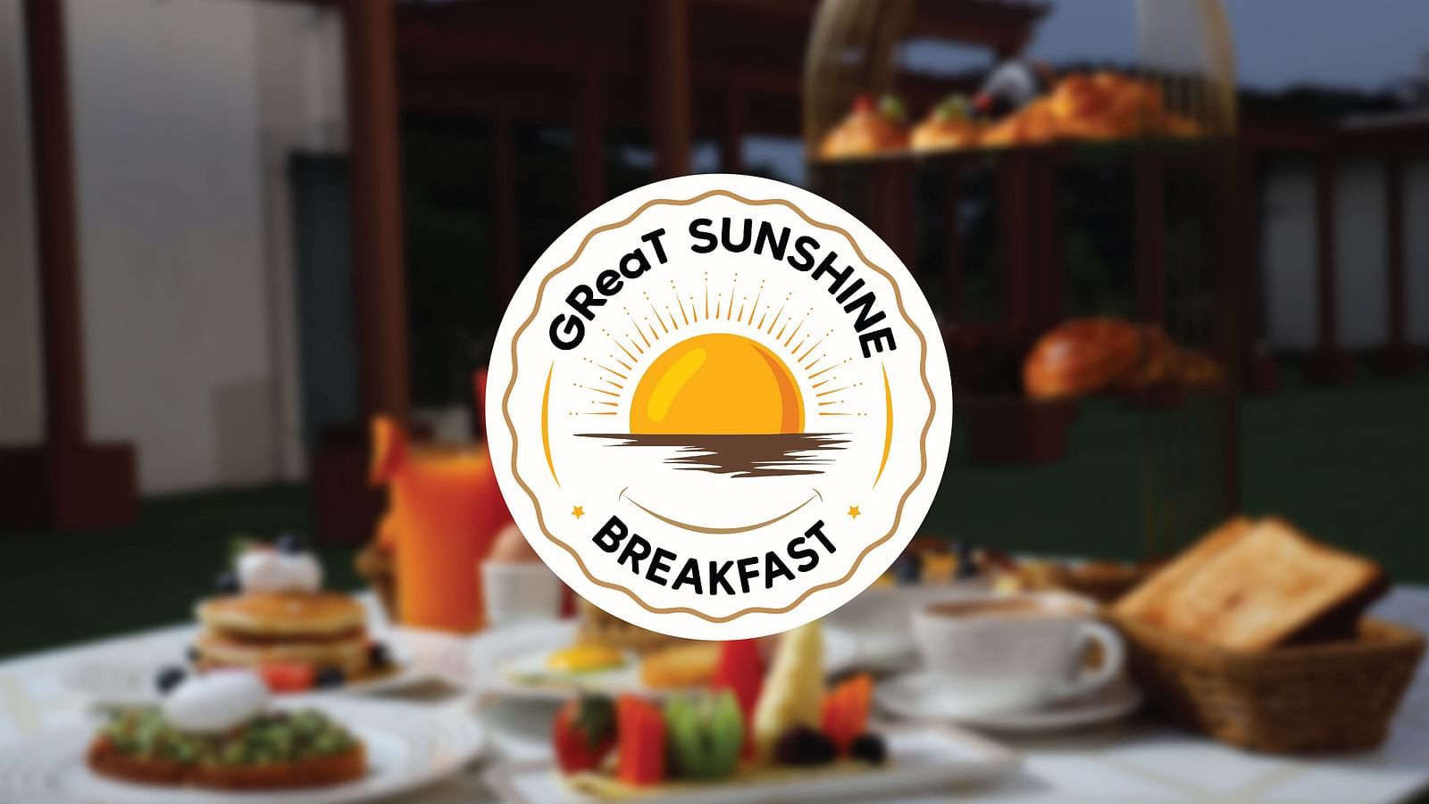 Logo of GReaT Sunshine Breakfast with a background of food placed on a table